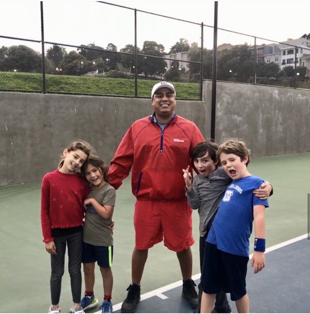 Julio with junior players