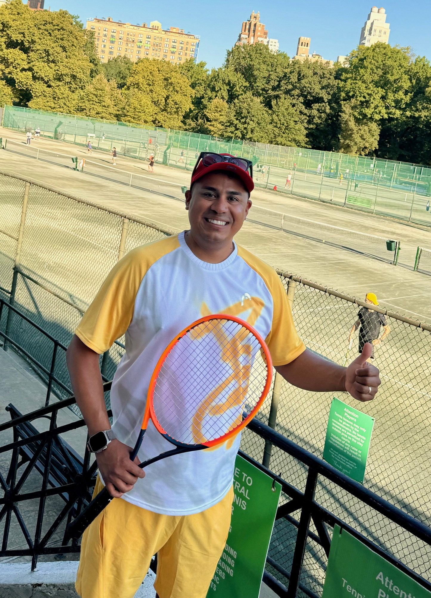 Coach Julio Munoz with his racquet at the courts